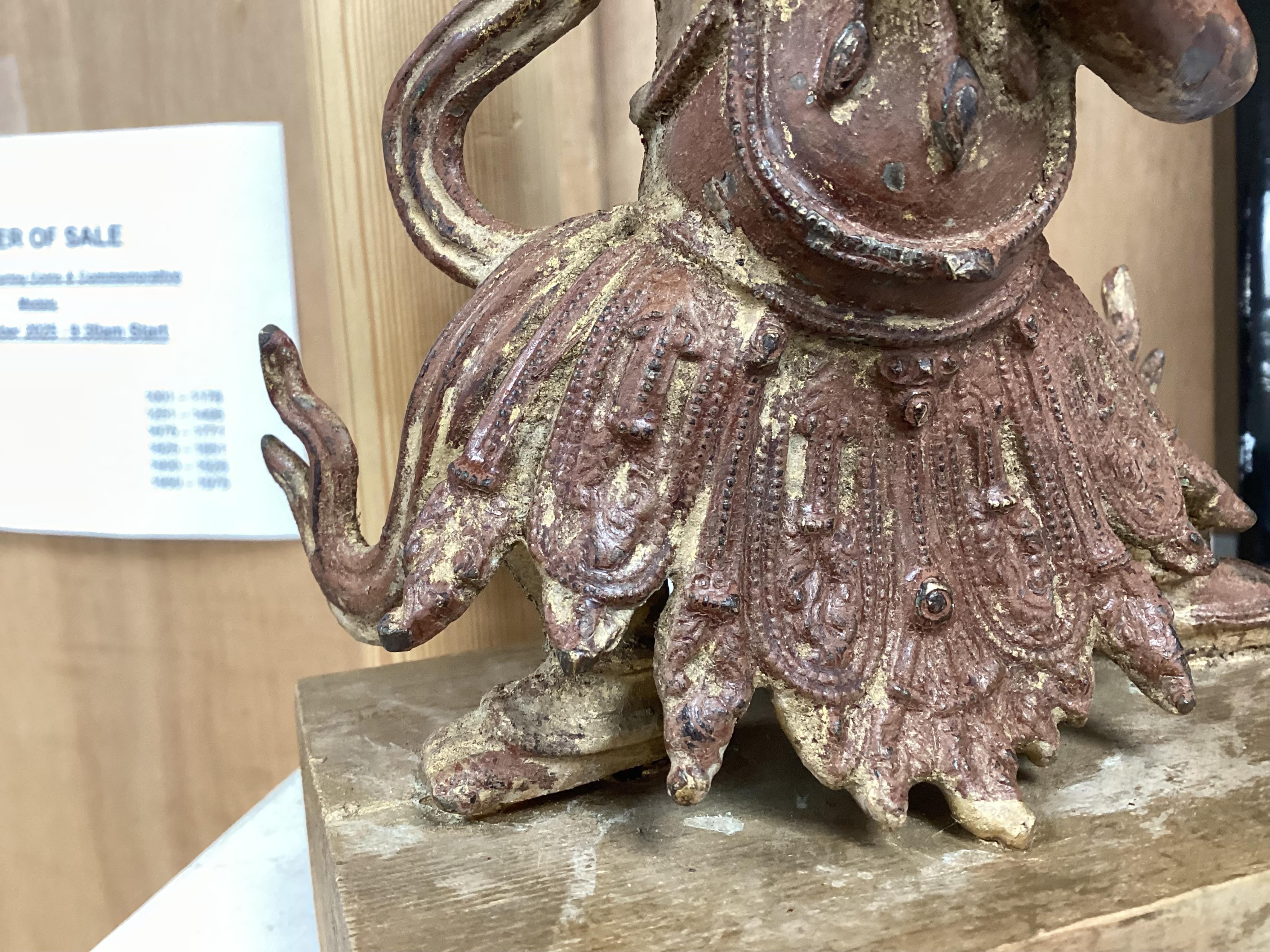 A Buddhist gilt bronze figure of Vaishravana, possibly Tibetan, 21 cm including wooden stand.
